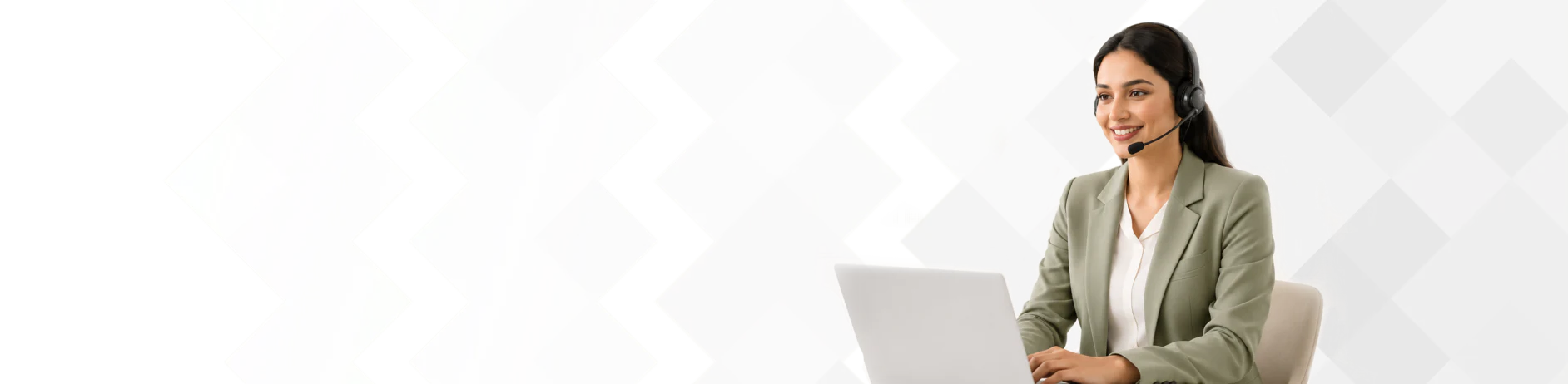 Support agent with a headset working at a laptop
